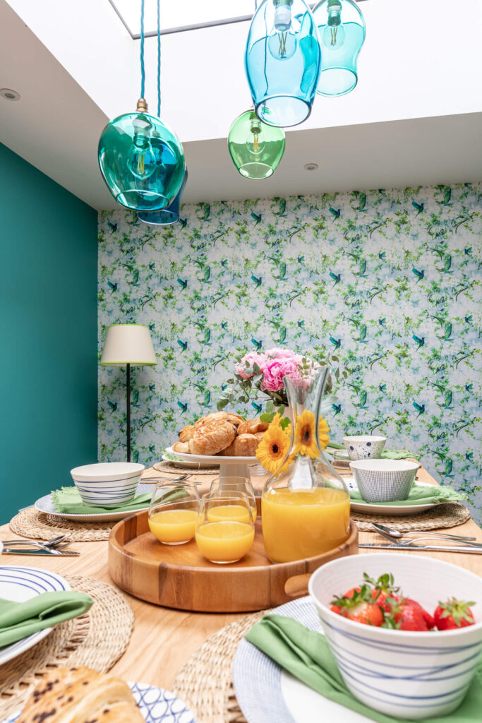 Dining area featuring a spring-inspired table setting with fresh flowers and vibrant tableware, perfect for updating your home decor for spring
