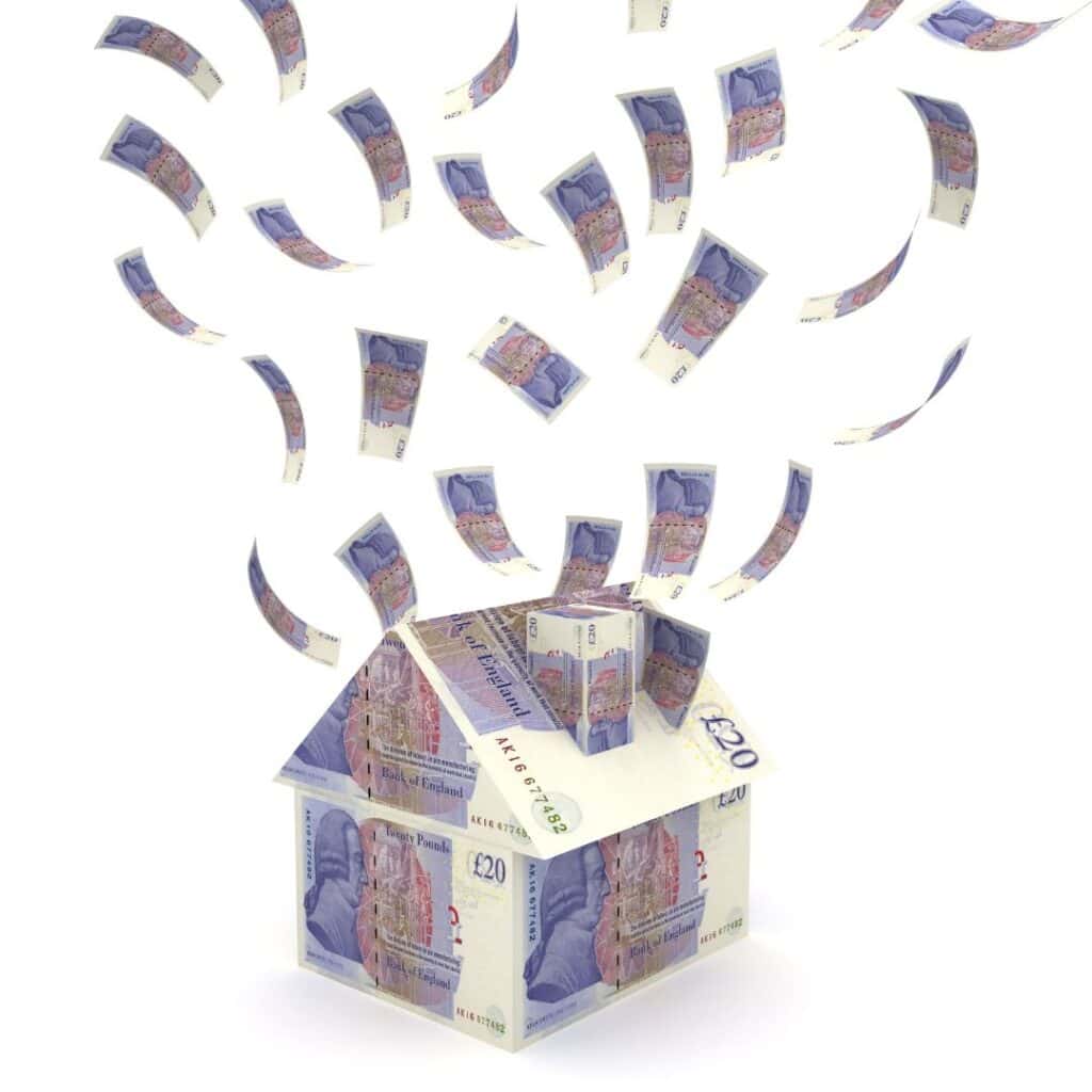 A house made out of UK twenty pound notes with notes flying around it.