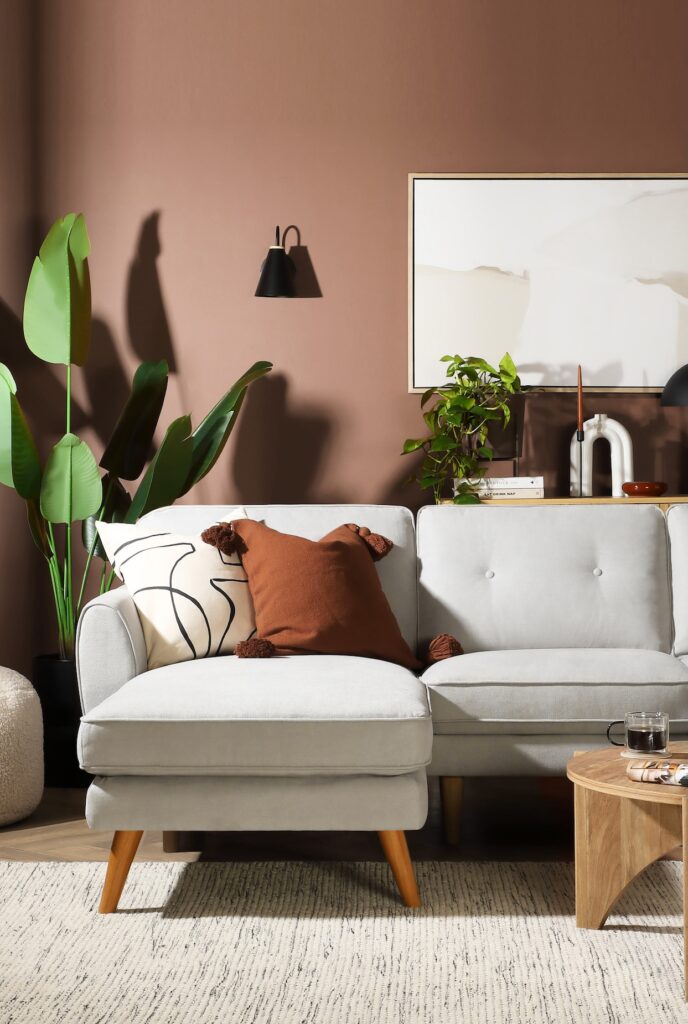 Furniture And Choice grey sofa styled with Mocha Mousse walls