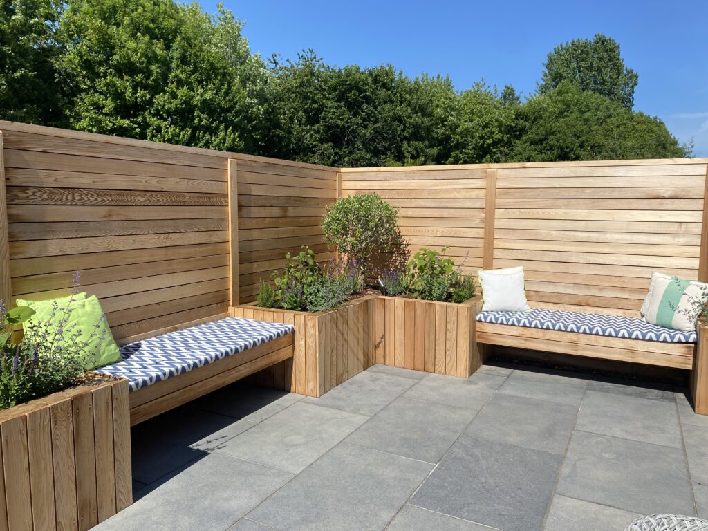 Box beds and benches create a relaxing outdoor space